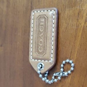 Coach brown leather hang tag